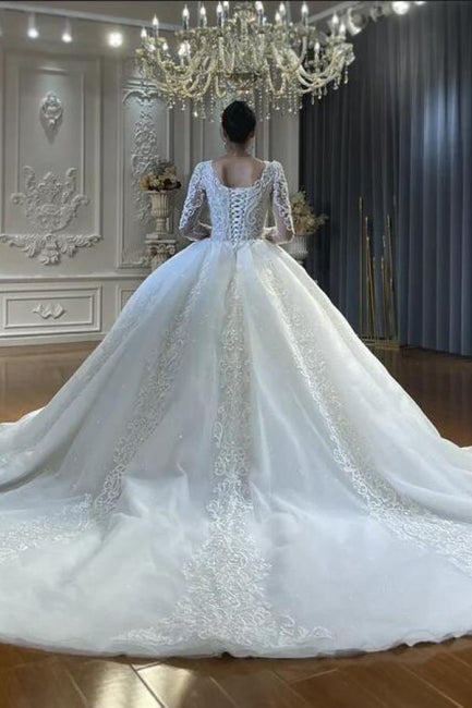 Vestido de novia de tul con escote corazón, mangas largas, apliques y encaje hasta el suelo
