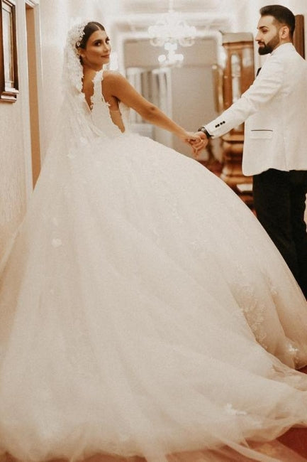 Vestido de novia largo hasta el suelo con mangas cortas color marfil