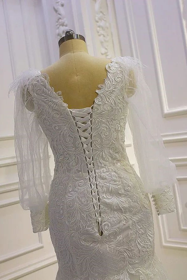 Wunderschönes Meerjungfrau-Brautkleid mit langen Ärmeln und Spitzenapplikationen und Schleppe