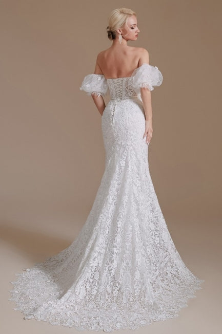 Wunderschönes schulterfreies, ärmelloses Meerjungfrau-Brautkleid in Bodenlänge mit Spitze und Applikation