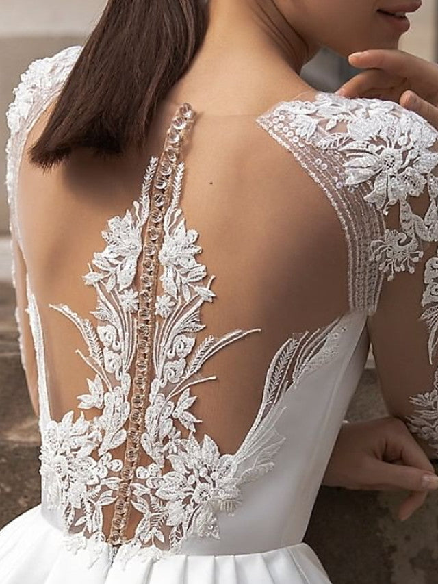 Vestidos de novia de satén con encaje, cola barrida, escote joya, manga larga, corte A y bolsillos