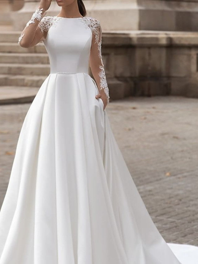 Vestidos de novia de satén con encaje, cola barrida, escote joya, manga larga, corte A y bolsillos