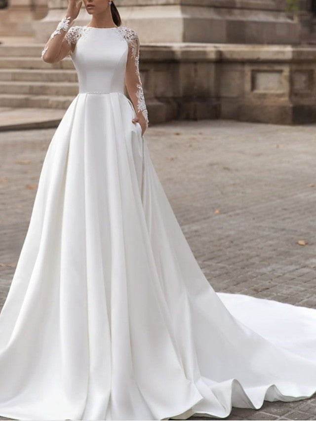 Vestidos de novia de satén con encaje, cola barrida, escote joya, manga larga, corte A y bolsillos