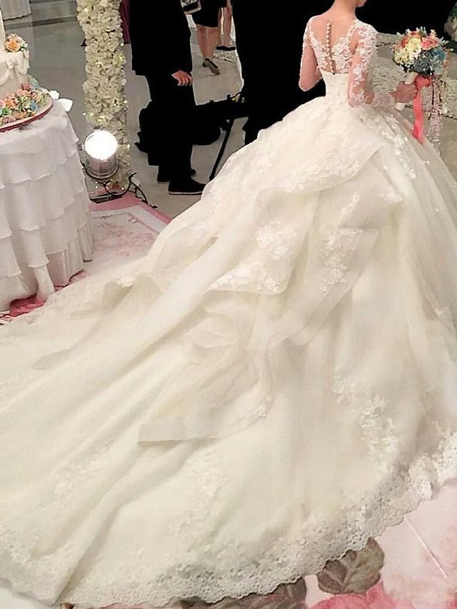 Vestidos de novia de organza con cola de corte y escote redondo y manga larga en A