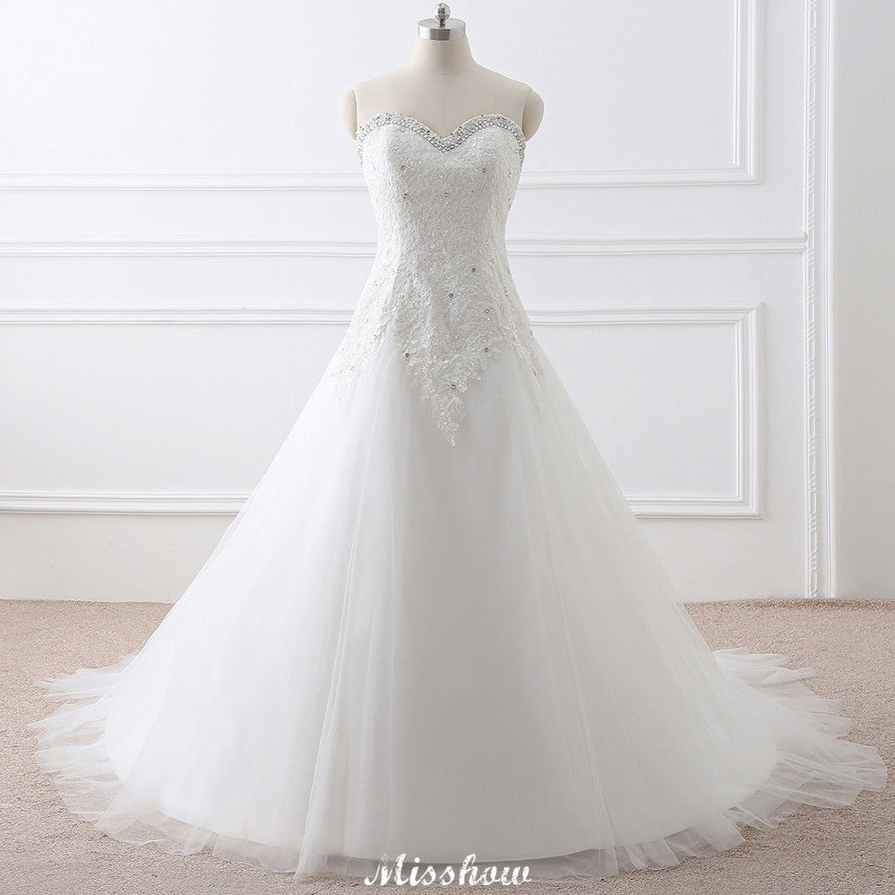 Vestido de novia princesa de tul con escote corazón y encaje