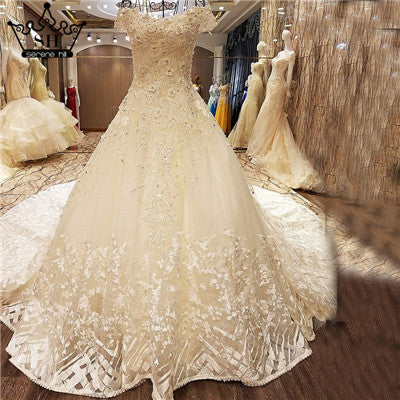 Vestidos de novia de tul sexy con hombros descubiertos, blancos, sin mangas, con lentejuelas de diamantes