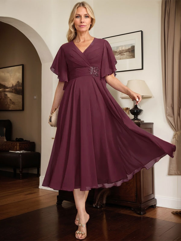 Vestido de gasa para madre de la novia con escote en V, corte A y largo hasta la rodilla, con cuentas plisadas