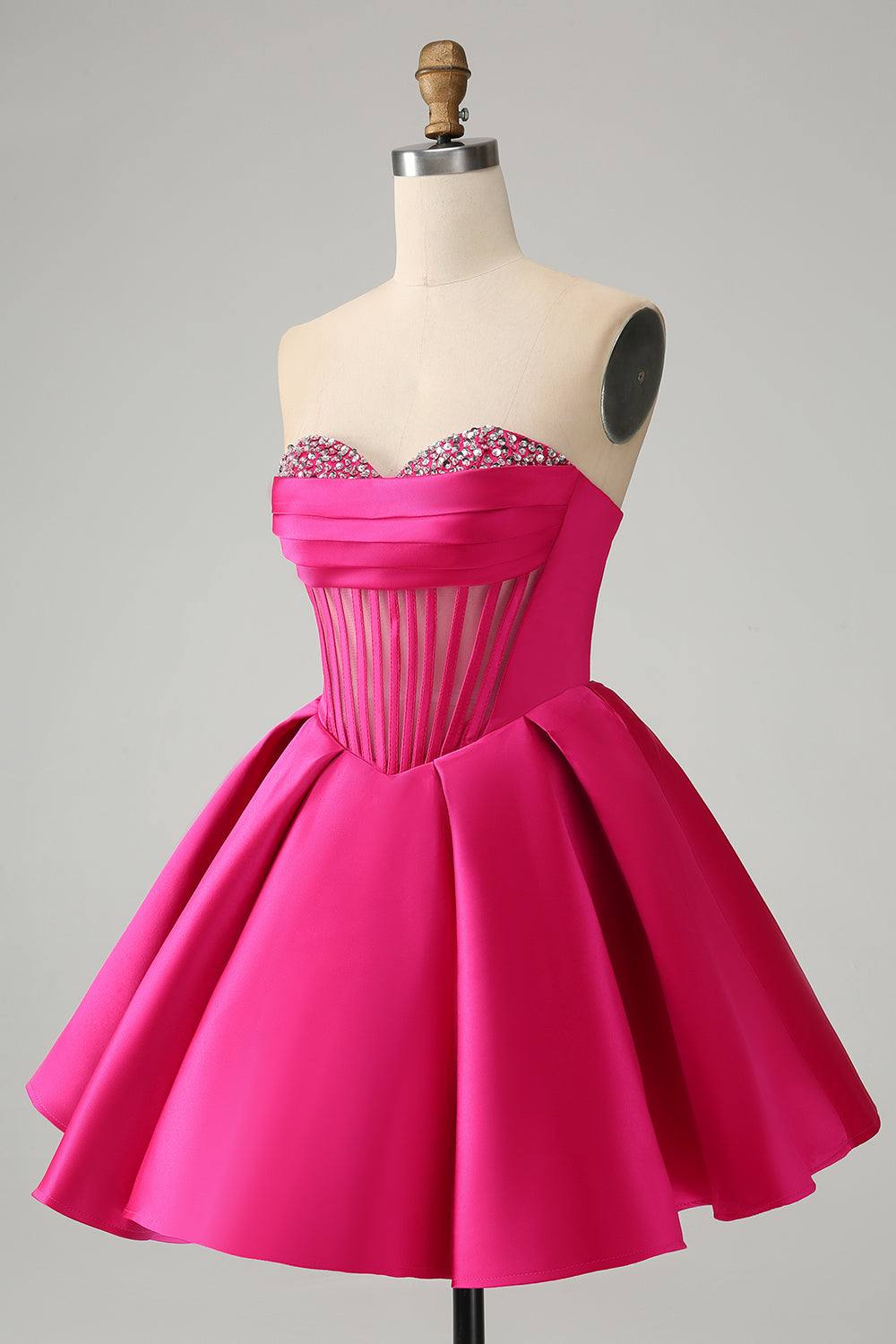Hermoso vestido de fiesta corto fucsia con escote en forma de A y corsé con cuentas