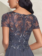 Vestido largo de madre de la novia con escote redondo, corte A, color gris carbón y cuentas