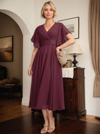 Vestido de gasa para madre de la novia con escote en V, corte A y largo hasta la rodilla, con cuentas plisadas