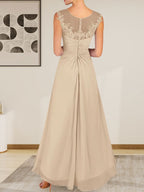 Vestido de gasa con encaje y escote redondo en forma de A color champán