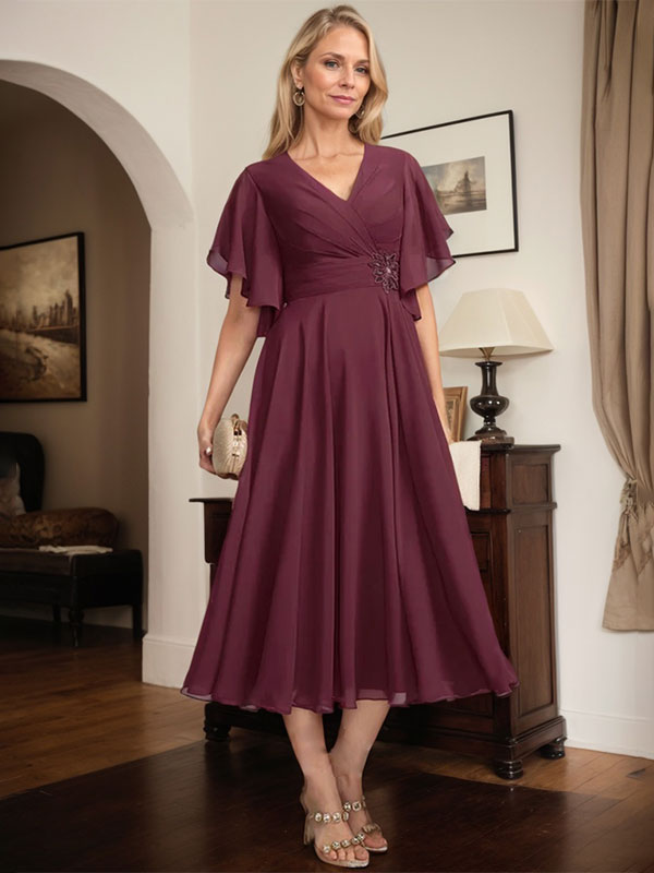 Vestido de gasa para madre de la novia con escote en V, corte A y largo hasta la rodilla, con cuentas plisadas