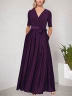 Vestido de gala con escote cruzado, falda de satén y corpiño de jersey