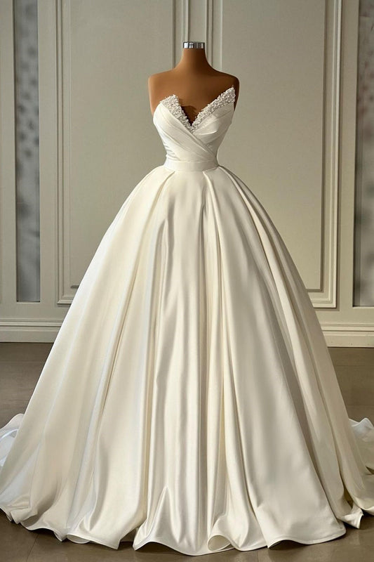 Wunderschönes langes elfenbeinfarbenes A-Linien-Prinzessinnen-Brautkleid aus Satin mit Perlen