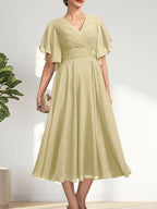 Vestido de gasa para madre de la novia con escote en V, corte A y largo hasta la rodilla, con cuentas plisadas