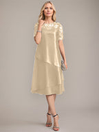 Vestido de madre de la novia con corte en A, escote redondo y largo hasta la rodilla, con apliques y lentejuelas