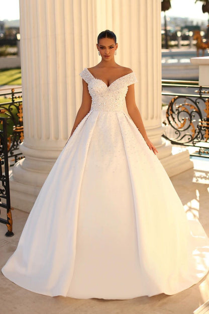 Encantador vestido de novia blanco largo con hombros descubiertos, corte A, lentejuelas y perlas