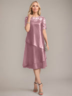 Vestido de madre de la novia con corte en A, escote redondo y largo hasta la rodilla, con apliques y lentejuelas