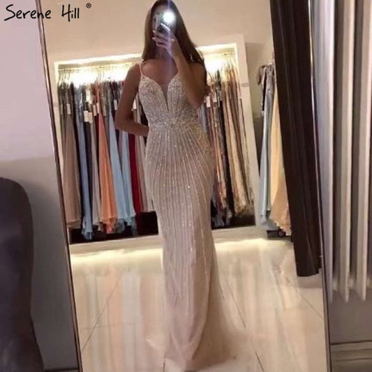 Dubai Champagner Ärmellose Meerjungfrau Sexy Abendkleider 2025 Perlen Pailletten Rückenfreies Abendkleid LA70400 