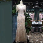 Vestido de noche de lujo estilo sirena color nude de Dubái, cuello redondo, manga corta, apliques de cuentas y borlas, LA70646 