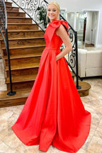 Aliya | Vestido de fiesta rojo de satén con un hombro al descubierto, lazo y bolsillos