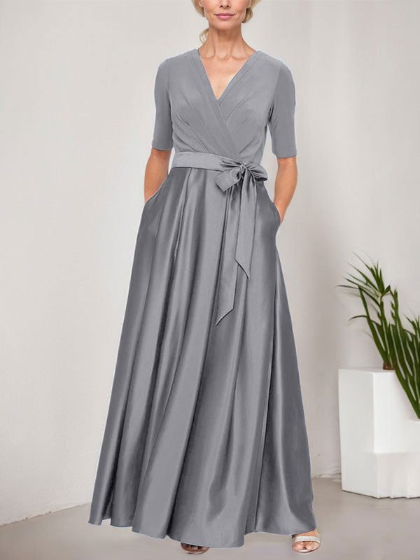 Vestido de gala con escote cruzado, falda de satén y corpiño de jersey