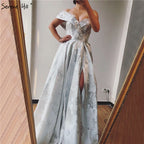 Im Angebot Keine Rückgabe Keine Rückerstattung Verkauf Elfenbein One Shoulder Sexy Abendkleider Lang 2025 Dubai Handgemachte Blumen Diamanten Abendkleid LA60947 