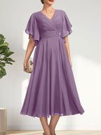 Vestido de gasa para madre de la novia con escote en V, corte A y largo hasta la rodilla, con cuentas plisadas