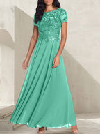 Vestido largo de madre de la novia con escote redondo, corte A, color gris carbón y cuentas