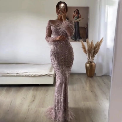 Vestidos de noche de lujo estilo sirena de Dubái, con plumas y cuentas azules de manga larga, 2025 LA60932 