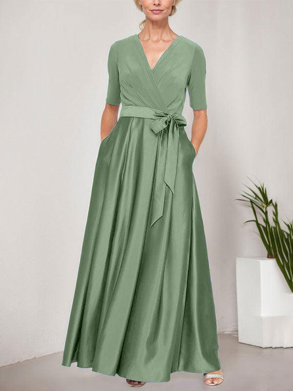 Vestido de gala con escote cruzado, falda de satén y corpiño de jersey