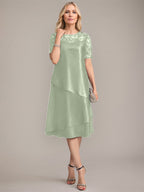 Vestido de madre de la novia con corte en A, escote redondo y largo hasta la rodilla, con apliques y lentejuelas