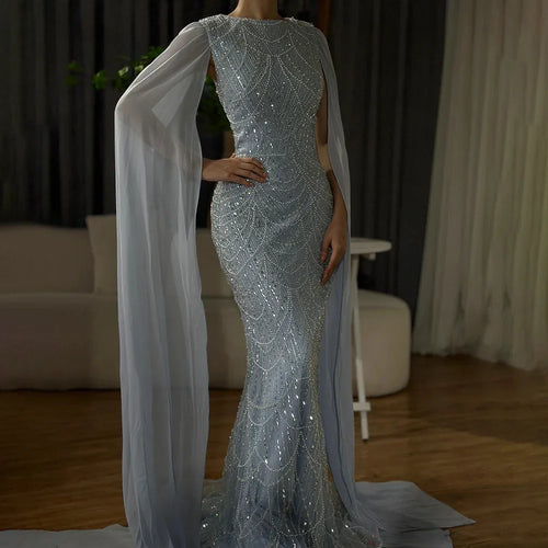 2025 Saudi-Arabien Blaues Meerjungfrau-Abendkleid mit Cape-Ärmeln und Perlenbesatz für formelle Anlässe LA72160A 