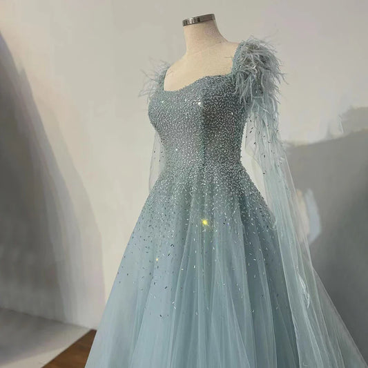 Vestidos de noche saudíes de lujo, corte A, azul árabe, con plumas, mangas capa y cuentas, para ocasiones formales 2025 LA71782A 