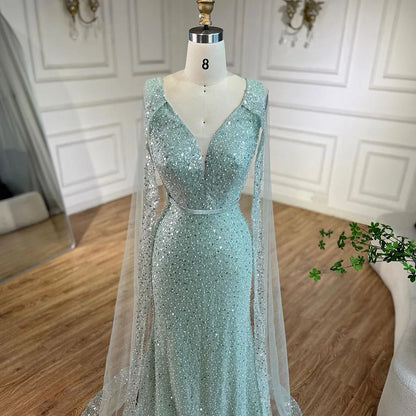 Vestido de noche árabe estilo sirena turquesa estilo Dubái con elegantes mangas de capa con cuentas de lujo para fiesta femenina 2025 LA72574