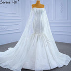 Vestidos de novia blancos de lujo estilo sirena 2025 con mangas estilo capa y perlas HM67278, hechos a medida 