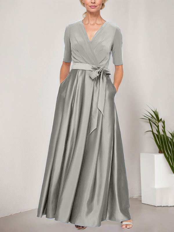 Vestido de gala con escote cruzado, falda de satén y corpiño de jersey