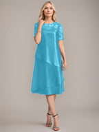 Vestido de madre de la novia con corte en A, escote redondo y largo hasta la rodilla, con apliques y lentejuelas