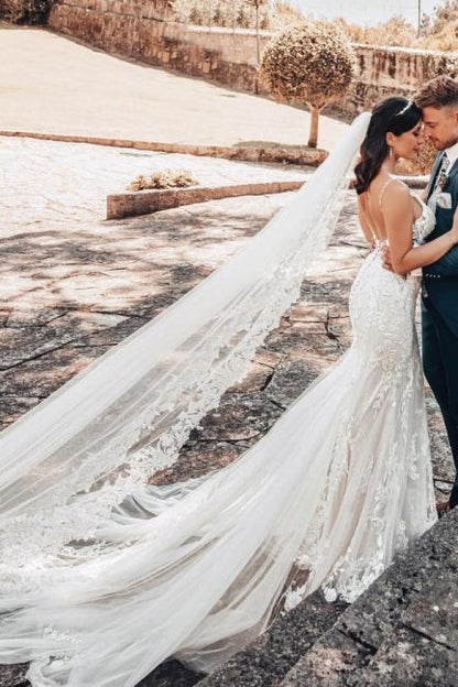 Vestido de novia de tul con escote en V, sin mangas y largo hasta el suelo, con encaje