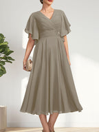 Vestido de gasa para madre de la novia con escote en V, corte A y largo hasta la rodilla, con cuentas plisadas