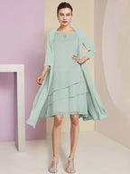 Vestidos de madre de la novia de corte A/princesa con escote joya y largo hasta la rodilla