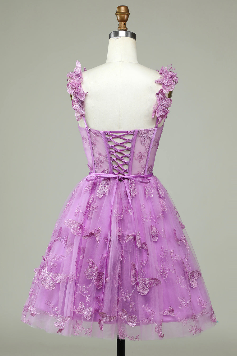 Bonito vestido de fiesta morado de corte A con corsé, corto y apliques