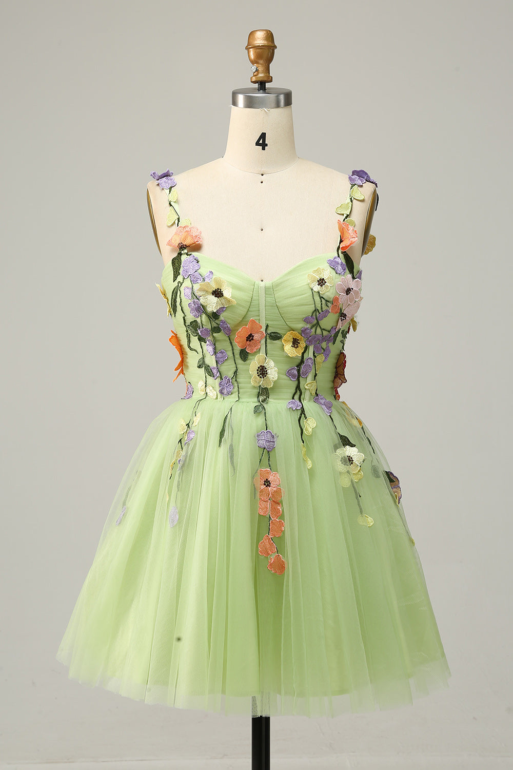Vestido corto de fiesta color champán con tirantes finos, corte A y apliques