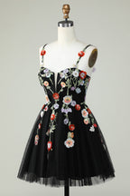 Vestido de fiesta negro de corte A con tirantes finos, lentejuelas y flores