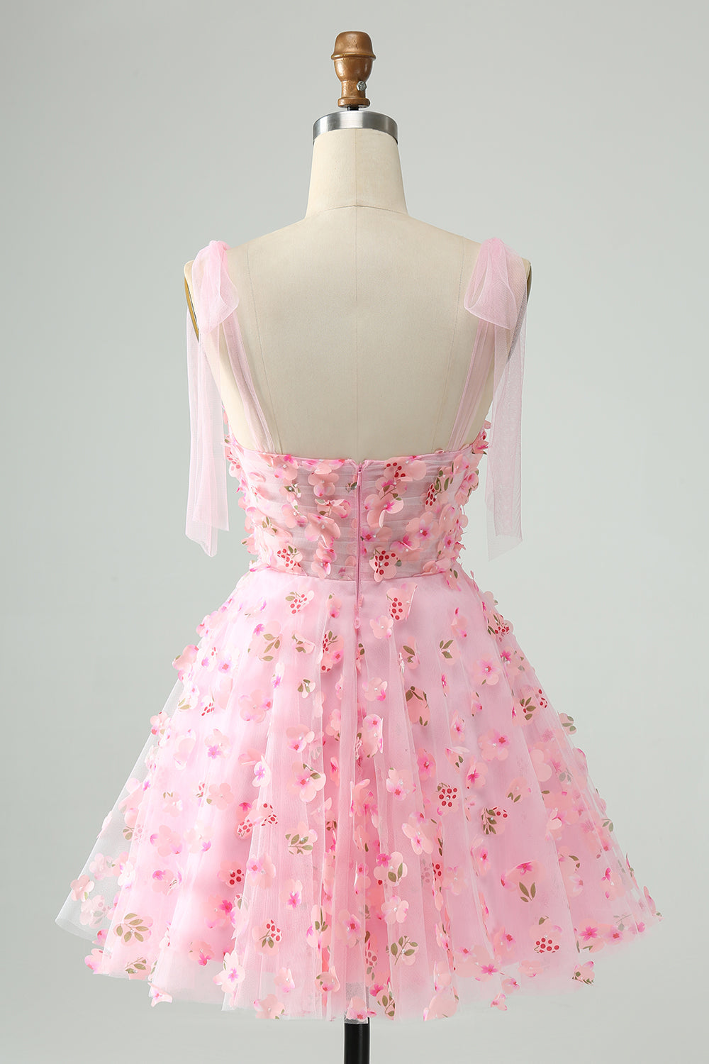 Bonito vestido de fiesta corto con corsé, perlas y corte en A en color rosa con apliques florales