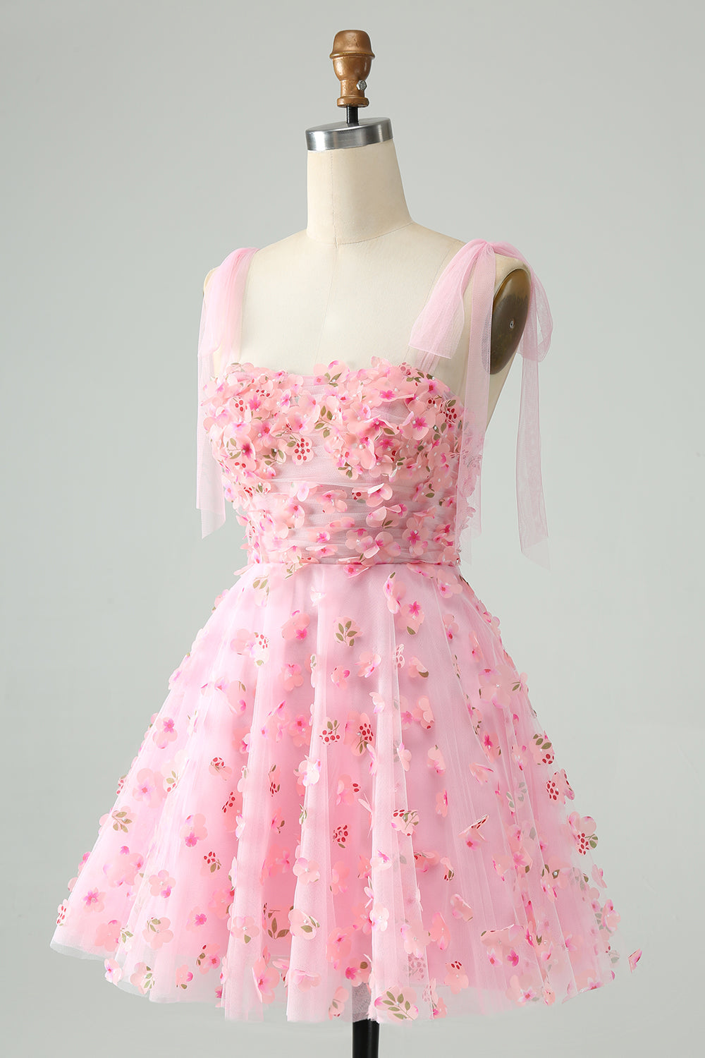Bonito vestido de fiesta corto con corsé, perlas y corte en A en color rosa con apliques florales