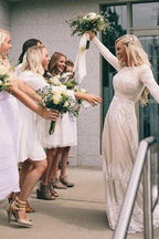 Vestido de novia de tul color marfil con mangas largas y corte barco y apliques WD399