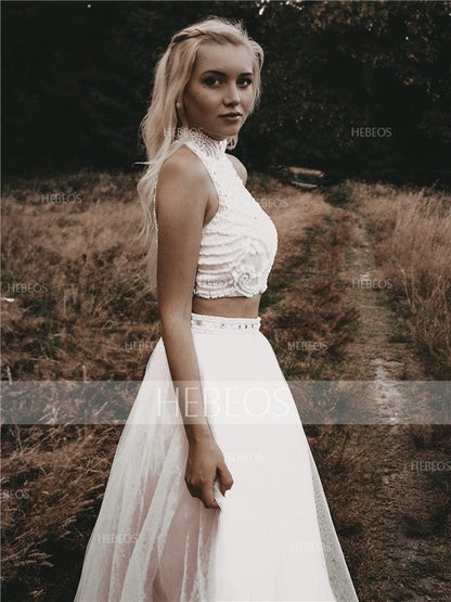 Elegante vestido de fiesta de corte A, sin mangas, cuello alto, tul con cuentas y largo hasta el suelo