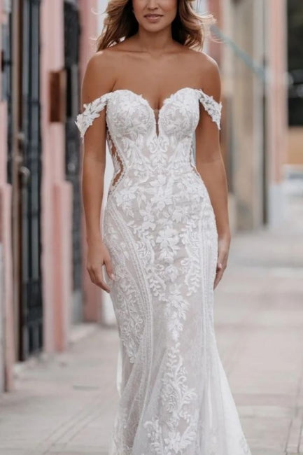 Impresionante vestido de novia blanco sin mangas con escote en forma de corazón, encaje y apliques.