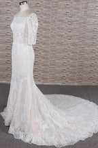 Impresionantes vestidos de novia elegantes con apliques y cola de corte sirena